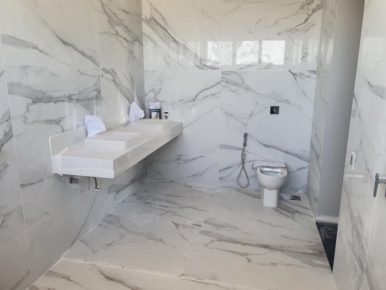 Finished marble-look bathroom with floating vanity installed by BBJ Flooring Corp